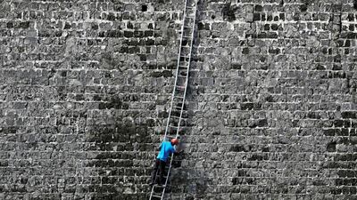 A worker cleans a wall at the Jaffna Fort, a fort built by the Portuguese in 1618, in Jaffna, Sri Lanka. Reuters