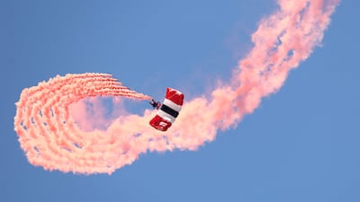 A member of the British Army parachute display team, the Red Devils, takes part in a display. AFP