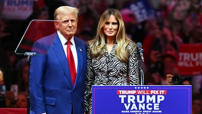 Donald Trump joins his wife Melania on stage during a campaign rally at Madison Square Garden in New York. AFP