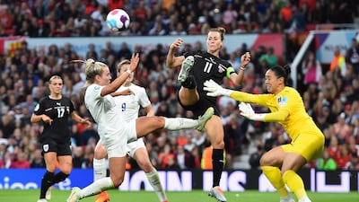 England's Lauren Hemp attempts to score against Austria goalkeeper Manuela Zinsberger while being tackled by Austria captain Viki Schnaderbeck. EPA
