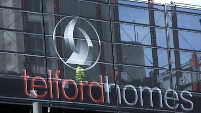 An advertising hoarding surrounds a Telford Homes residential apartment block in the Stratford district of London. The company said last week it had sold three penthouse apartments in the once-down-at-heel area. Chris Ratcliffe/Bloomberg