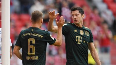 Bayern Munich's Joshua Kimmich celebrates scoring their sixth goal with Robert Lewandowski. Reuters