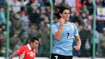Edinson Cavani, right, and Luis Suarez have finally gotten the chance to show how they fit in with a bunch of 23 year olds. A 6-4 win by the Uruguay side against Chile makes the formula look successful so far.