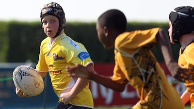 The Dubai Hurricanes blasted past an Al Ain defender to score during game action on Friday, January 22, 2016, at the HSBC Rugby Festival Dubai. DELORES JOHNSON / The National