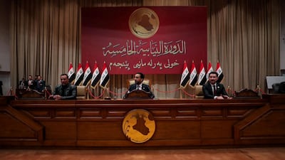 Iraq's speaker of parliament Mohammed Al Halbousi, centre, and his deputies Hakim Al Zamili and Shakhwan Abdulla in Baghdad on January 9, 2022. Reuters