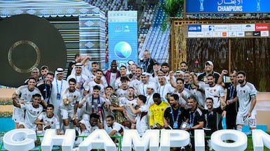 Al Wahda players celebrate after beating Al Ain to win the ADIB Cup. Al Wahda FC