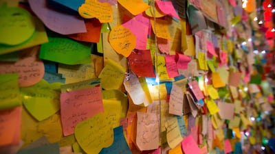 A "wishing wall" set up by demonstrators is seen in Tahrir Square. AFP