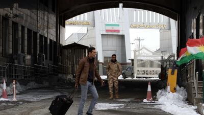 An Iranian man arrives at the Iran-Iraq border crossing of Haji Omran on January 3, 2018, one of two border posts between Iraqi Kurdistan and the Islamic republic that were reopened a day earlier after being closed for months following an independence referendum in Iraqi Kurdistan. Safin Hamed / AFP