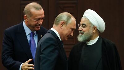 Turkish President Recep Tayyip Erdogan (L), Russian President Vladimir Putin (C) and Iranian President Hassan Rouhani (R) leave after a press conference following a trilateral meeting on Syria, in Ankara on September 16, 2019. AFP