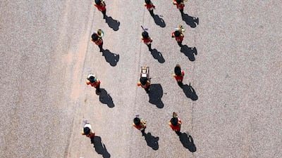 Members of the F Company Scots Guards military band leave after a military ceremony to mark Queen Elizabeth II's official birthday. AFP