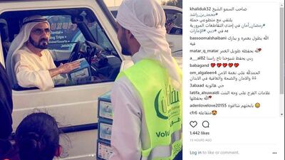 Sheikh Mohammed bin Rashid, Vice President and Ruler of Dubai, praises Al Ihsan Charity Association members for distributing meals on a busy road ahead of iftar. Courtesy khaliduk32 Instagram account
