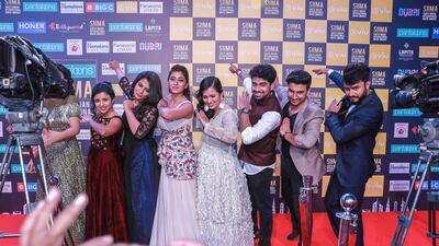 TV broadcasters strike a pose after the 2018 SIIMA red carpet event Victor Besa / The National