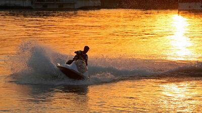 An Iraqi rides a jet-ski on the river Tigris, in the Adhamiya district of Iraq's capital Baghdad. AFP
