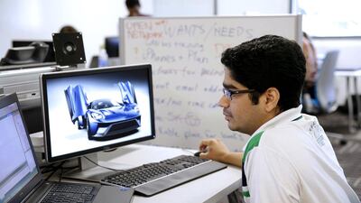 A research engineer works on image processing at the Ford research laboratory in Palo Alto. Eric Risberg / AP Photo