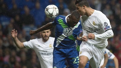 Real Madrid’s Portuguese forward Cristiano Ronaldo scores during the Champions League quarter-final second leg football match Real Madrid v Wolfsburg at the Santiago Bernabeu stadium in Madrid on April 12, 2016. AFP / CURTO DE LA TORRE