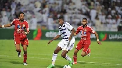 Asamoah Gyan, centre, was not at his best against Al Jazira last night. Imran Shahid / Al Ittihad