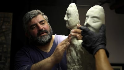 Omar Sartawi, a Jordanian chef recreates an ancient statue found in Jordan using a famous local product - Jameed (dried goat's milk used in the country's national dish), at his workshop in Amman, Jordan. REUTERS