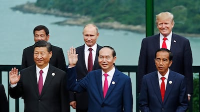 Chinese President Xi Jinping with other world leaders at the APEC Summit in Danang, Vietnam. Jorge Silva / AP