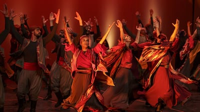 Members of the Funoun Palestinian Popular Dance Troupe perform during the Palestine International Festival for Music and Dance (PIF) in the city of Ramallah in the occupied West Bank on June 30, 2022. (Photo by ABBAS MOMANI / AFP)