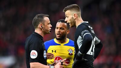 Alex McCarthy of Southampton argues with referee Stuart Attwell. Getty Images