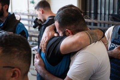 People attend the funeral for a paramedic killed in an Israeli attack on Nabatieh. Getty Images