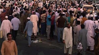 Worshippers gather after a suicide bomber detonated a device near the security headquarters of the Prophet's Mosque in Medina, July 4, 2016. REUTERS/Handout