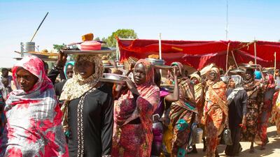 Sudanese women take part in a sit-in to protest against the end of the mandate of the United Nations and African Union peacekeeping mission (UNAMID), in Kalma camp for internally displaced people in Nyala, the capital of South Darfur. AFP