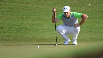Alex Noren lines up a putt on the 7th green during the second round of the DP World Tour Championship. Ross Kinnaird / Getty Images