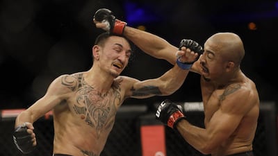 Jose Aldo, left, trades punches with Max Holloway during their UFC Featherweight bout in Rio de Janeiro, Brazil, early Sunday, June 4, 2017. Leo Correa / AP Photo