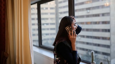 An Iranian woman in Tehran tries to contact relatives living abroad, after nationwide unrest led to an internet shutdown. Reuters