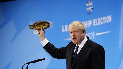 Conservative MP and leadership contender Boris Johnson holds up kipper fish in plastic packaging as he speaks at the final Conservative Party leadership election hustings in London, on July 17. The battle to become Britain's next prime minister enters the home straight on Wednesday with both candidates hardening their positions on Brexit, putting the future government on a collision course with Brussels. AFP