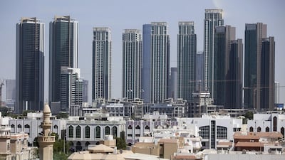 A view of the older parts of Abu Dhabi, backed by the new high-rise buildings on Al Reem Island. Silvia Razgova / The National