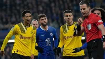 Jude Bellingham, left, argues with referee Danny Makkelie after his decision to award Chelsea a penalty against Borussia Dortmund. AP