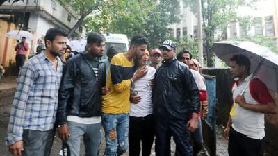 Family members mourn victims outside a hospital in Bhopal, India. EPA