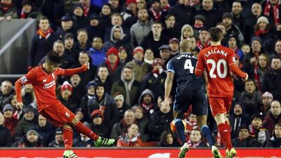 Football Soccer - Liverpool v Manchester City - Barclays Premier League - Anfield - 2/3/16Liverpool's Roberto Firmino scores their third goalAction Images via Reuters / Lee SmithLivepicEDITORIAL USE ONLY. No use with unauthorized audio, video, data, fixture lists, club/league logos or "live" services. Online in-match use limited to 45 images, no video emulation. No use in betting, games or single club/league/player publications. Please contact your account representative for further details.