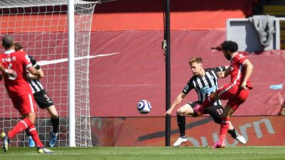 Liverpool's Mohamed Salah scores the opener. AP