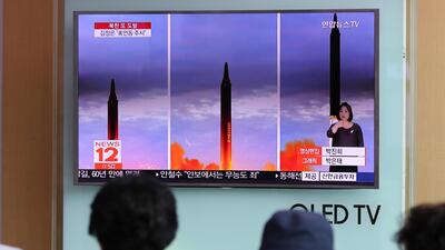 Moody's says that aggression from North Korea - which this week fired a missile over Japan - and rhetoric from US President Donald Trump has heightened the risk of conflict in the Korean Peninsula. Lee Jin-man / AP