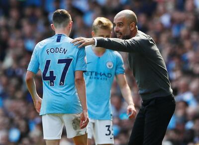 Manchester City manager Pep Guardiola, right, described Phil Foden as a 'special' player. Reuters