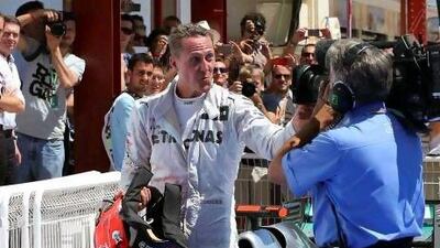 Michael Schumacher has fun with the camera after finishing third at the European Grand Prix on Sunday, his best result of the season. Valdrin Xhemaj / EPA