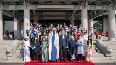 Sheikh Mohamed bin Zayed and Mr Moon stand for a photograph during a reception at Blue House. Ryan Carter / Ministry of Presidential Affairs