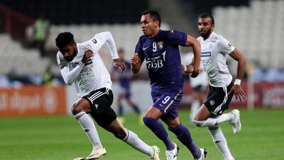 Al Ain's Douglas, in purple, has shown good form in the Arabian Gulf League, but he needs to raise his level in the continental championship. Christopher Pike / The National