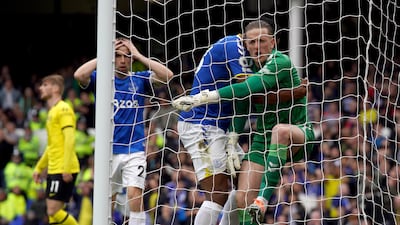 Everton goalkeeper Jordan Pickford celebrates after his save from Cesar Azpilicueta. PA