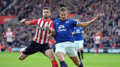 Southampton striker Shane Long, left, vies with Everton defender Phil Jagielka during their English Premier League match at St Mary's Stadium in Southampton, England, on December 20, 2014. Glyn Kirk / AFP