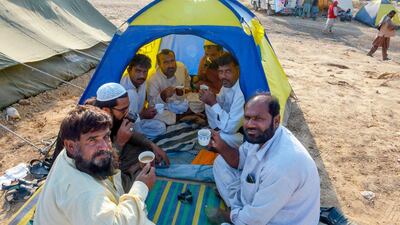 Supporters drink tea during an anti-government march. AFP
