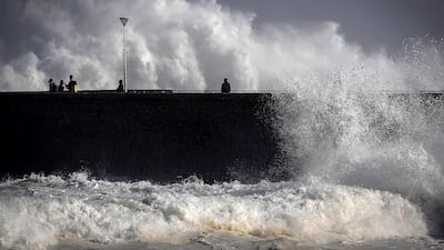 People walk along the beach next to the Kursaal breakwater in San Sebastian, Basque Country, Spain. EPA