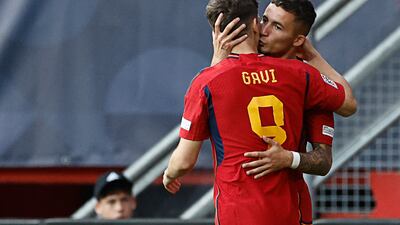 Yeremy Pino celebrates scoring with Spain teammate Gavi. AFP