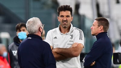 Juventus goalkeeper Gianluigi Buffon out on the Allianz Stadium pitch as players and officials await word of Napoli's no-show. Reuters