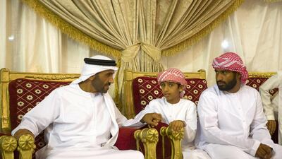 Sheikh Nahyan Bin Zayed, Chairman of the Board of Trustees of Zayed bin Sultan Al Nahyan Charitable and Humanitarian Foundation, left, offers condolences to the family of martyr Mohammed Saeed Al Hassani, who passed away while serving with the UAE Armed Forces in Yemen. Mohamed Al Hammadi / Crown Prince Court - Abu Dhabi-