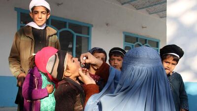 An Afghan health worker administers a polio vaccine in Kandahar. Afghanistan and Pakistan are the only two countries where polio remains endemic, crippling hundreds of children every year. Muhammed Sadiq / EPA