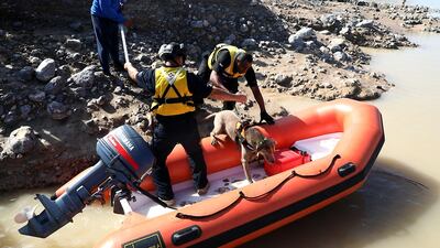 Search and rescue teams look for the body of a man who went missing in a flash flood last Saturday. Courtesy RAK Police
